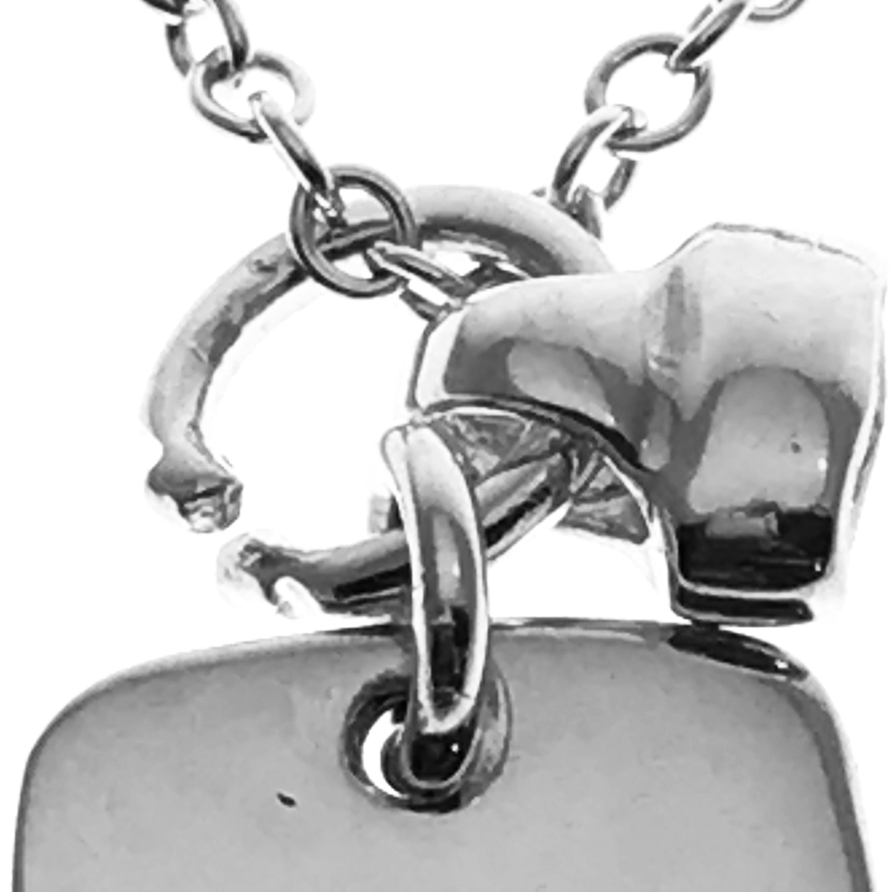 silver tag and bell