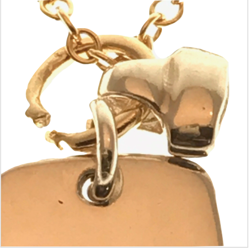 gold tag and bell